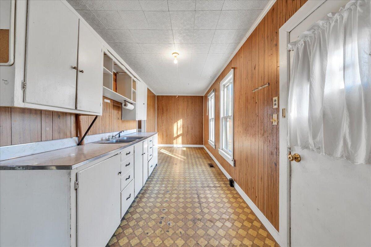 5402 Roanoke Road Troutville, VA 24175 - Photo 16 of 54 a hallway with sink and mirror