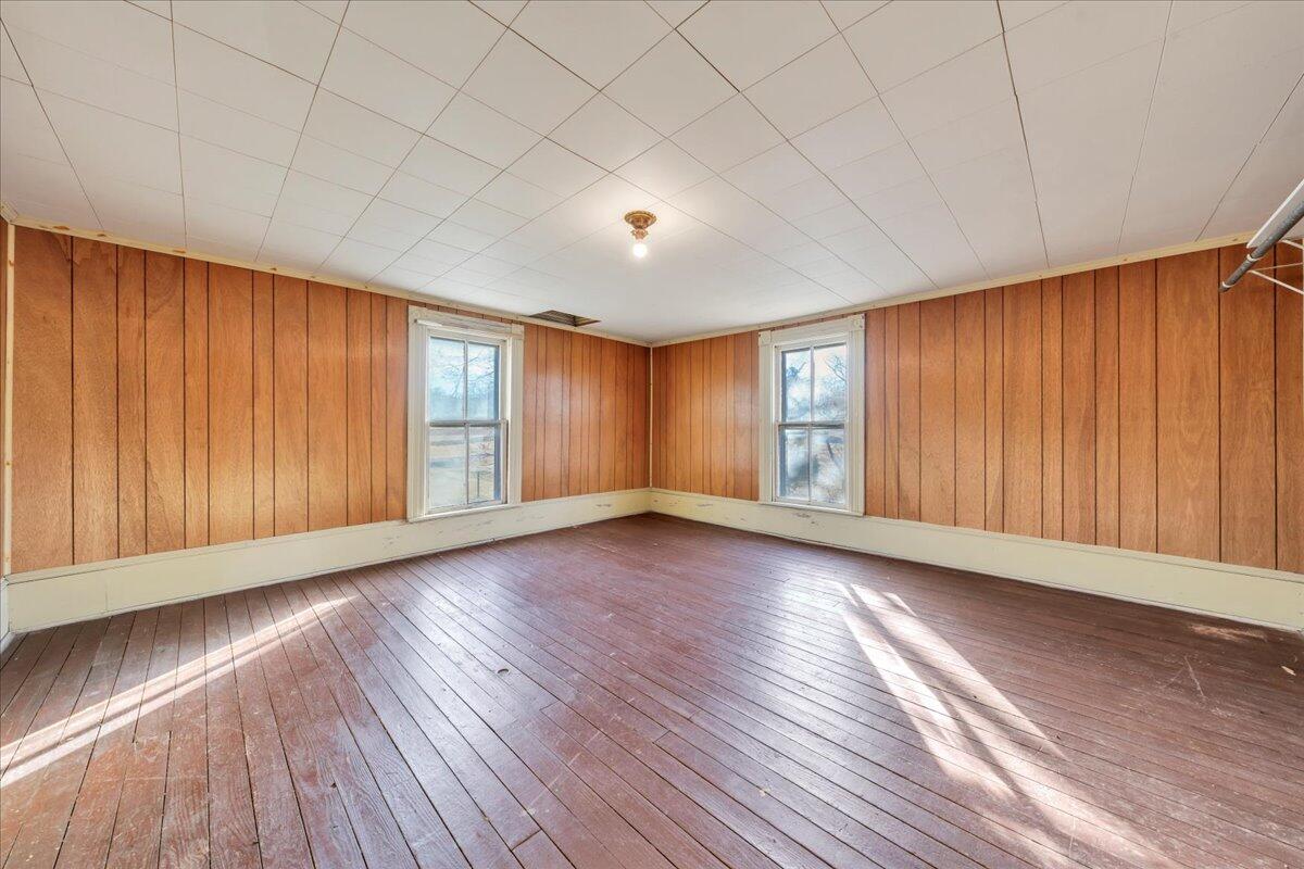 5402 Roanoke Road Troutville, VA 24175 - Photo 25 of 54 an empty room with wooden floor and windows