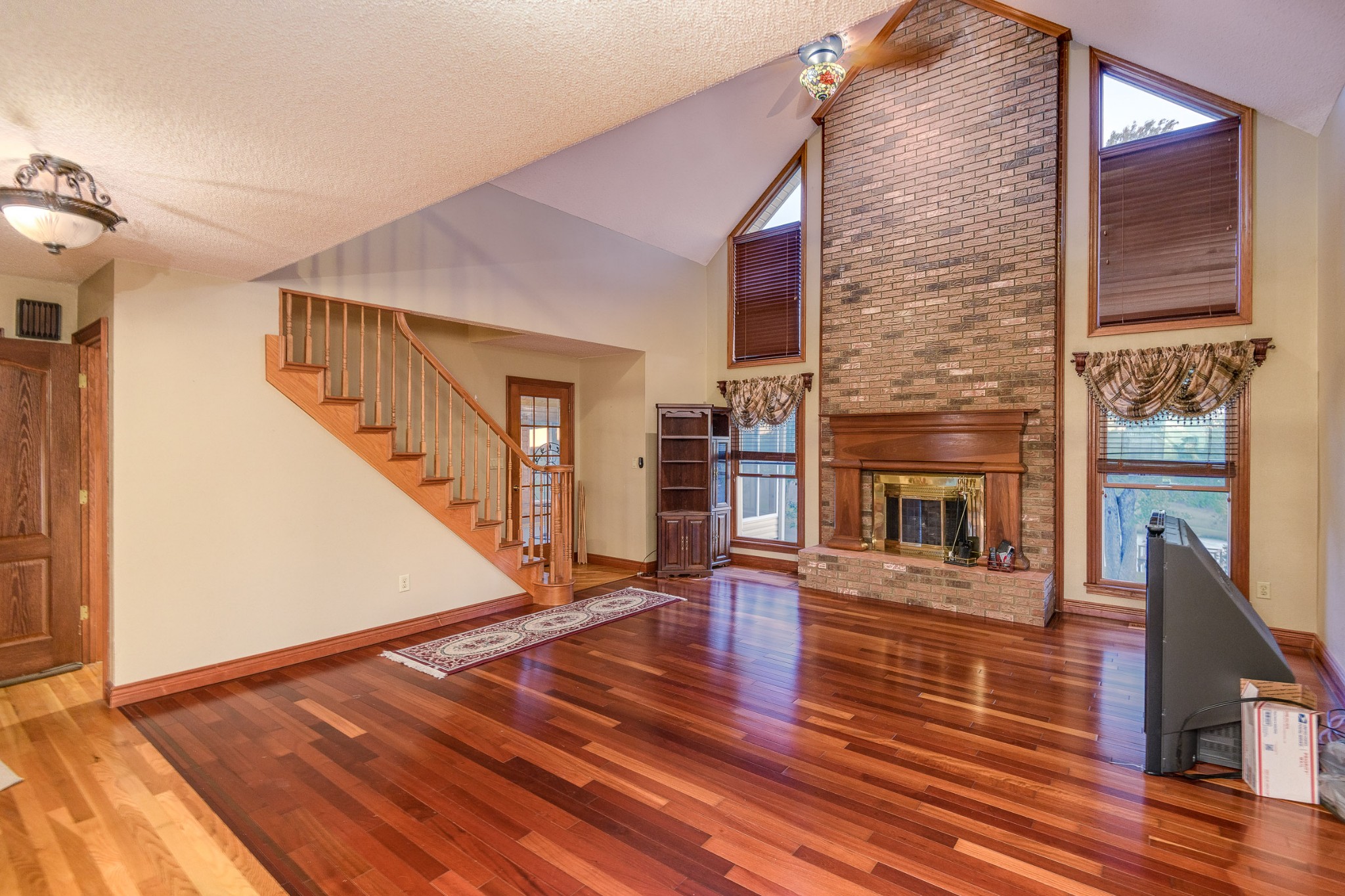 1534 Old Shannon Road Lebanon, TN 37090 - Photo 11 of 56 a view of a livingroom with wooden floor and a staircase