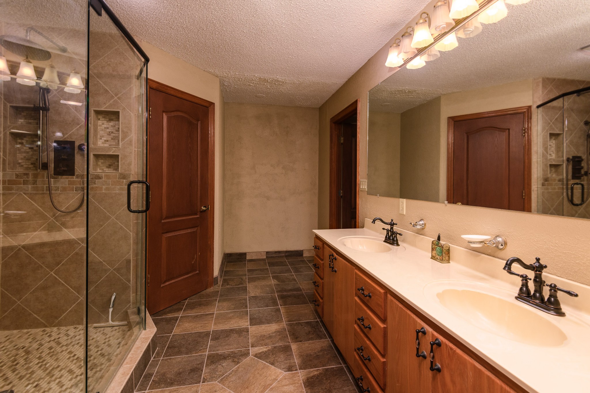 1534 Old Shannon Road Lebanon, TN 37090 - Photo 25 of 56 a spacious bathroom with a double vanity sink a mirror and a shower