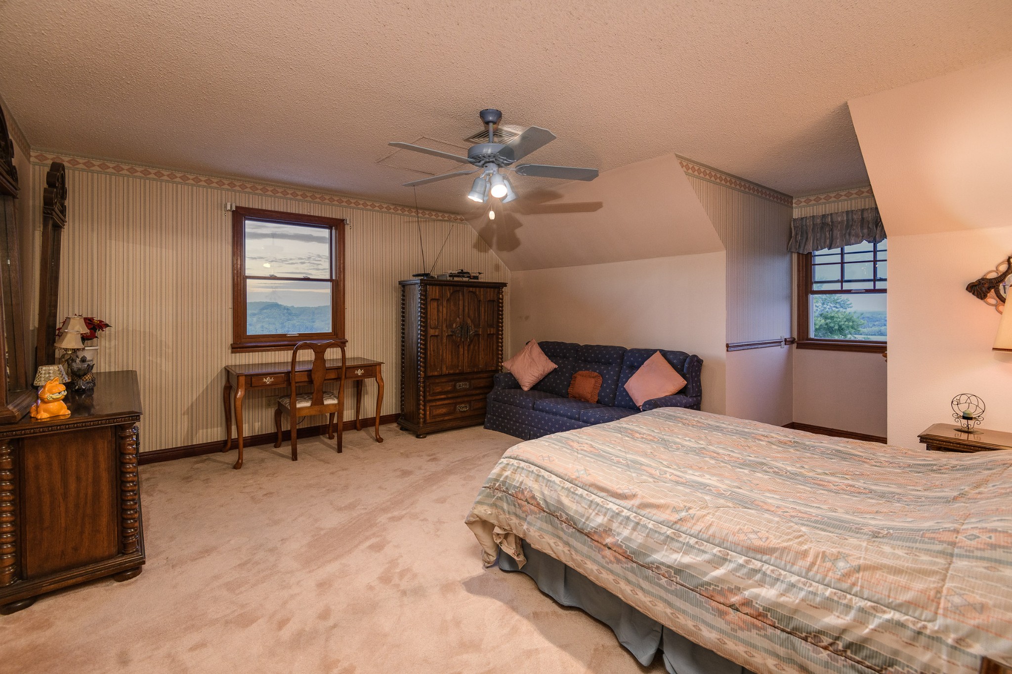 1534 Old Shannon Road Lebanon, TN 37090 - Photo 49 of 56 a bedroom with bed and a chandelier
