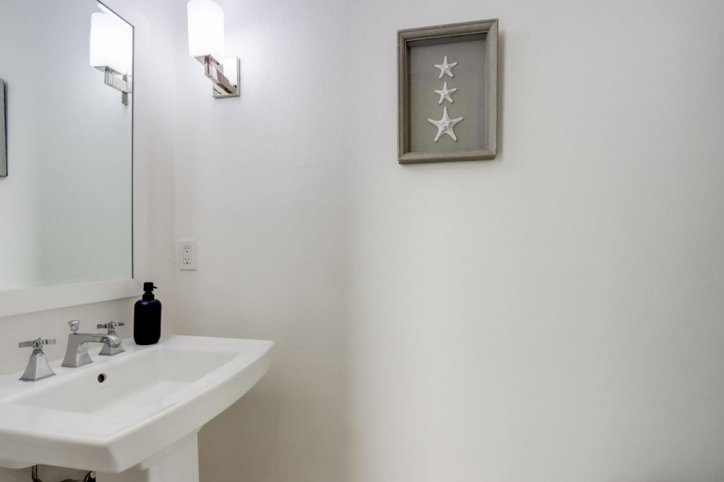 612 Allerton Loop Campbell, CA 95008 - Photo 11 of 38 a bathroom with a sink and a mirror