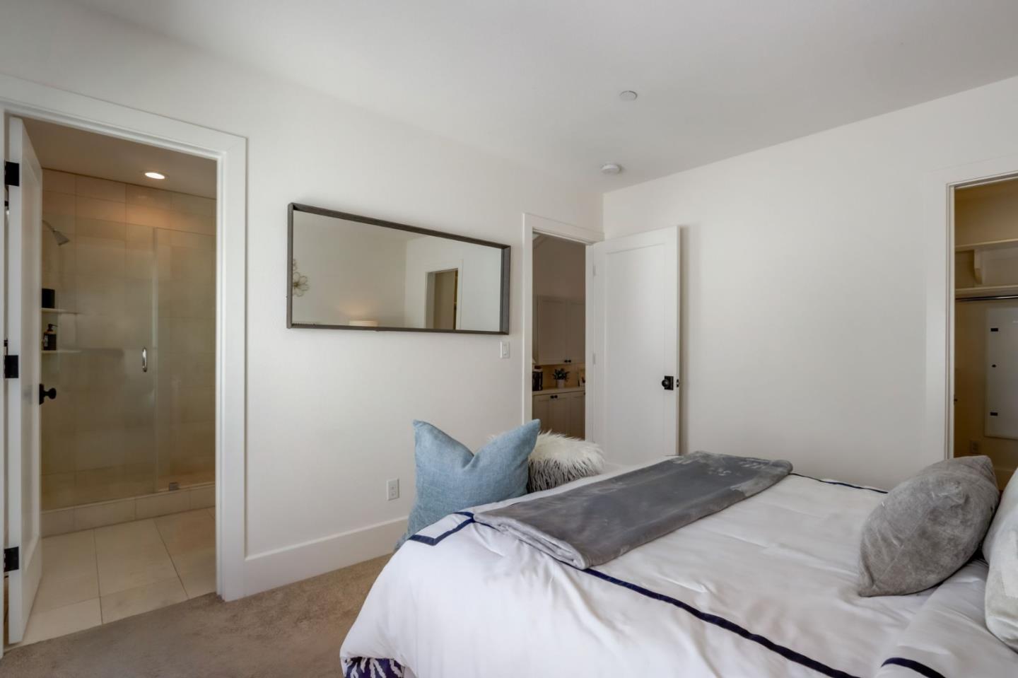 612 Allerton Loop Campbell, CA 95008 - Photo 15 of 38 a bedroom with a bed and a mirror