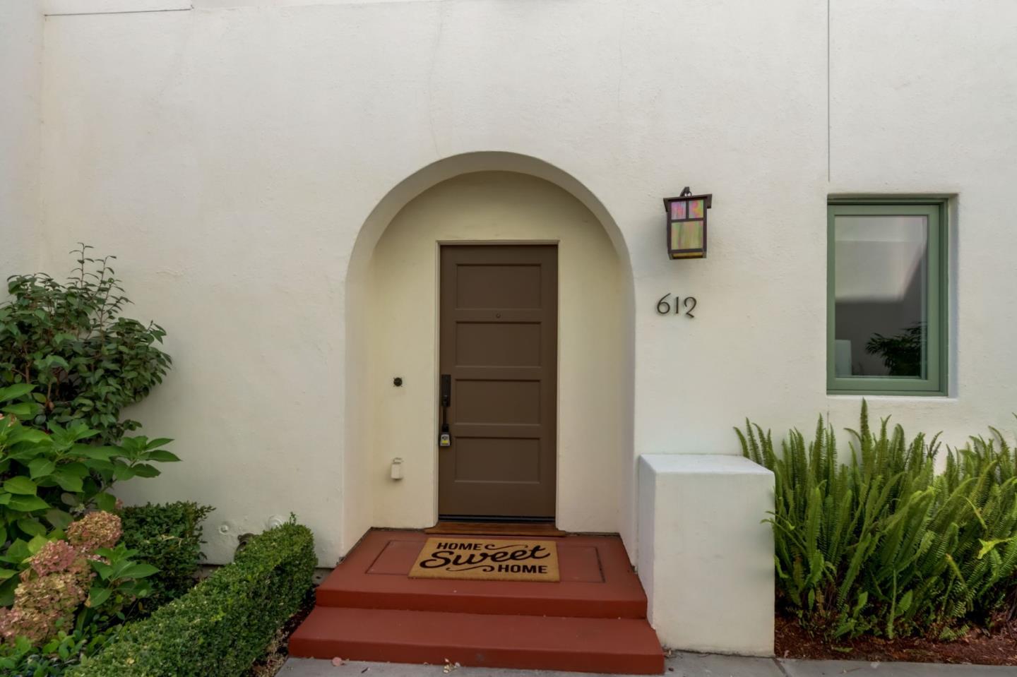 612 Allerton Loop Campbell, CA 95008 - Photo 28 of 38 a front view of a house with a garden
