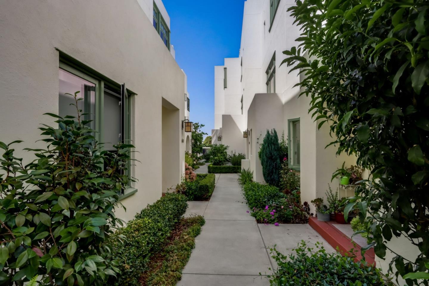 612 Allerton Loop Campbell, CA 95008 - Photo 31 of 38 a view of a pathway with potted plants and a building