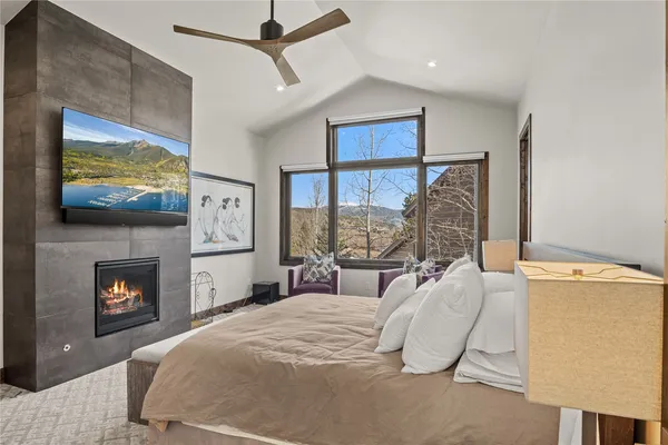 a bedroom with a bed and a lamp