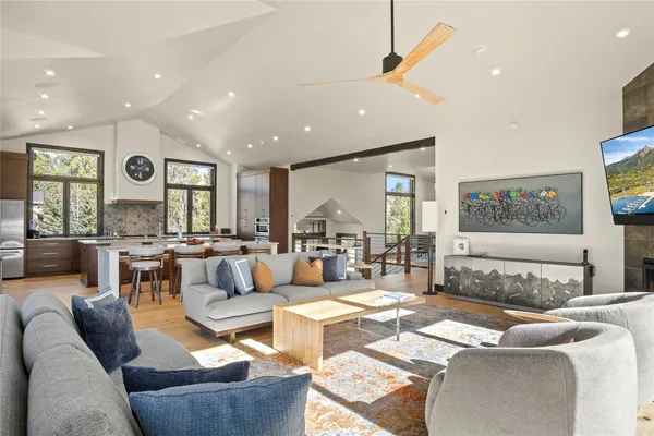 a living room with furniture and a large window