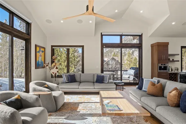 a living room with furniture and a large window