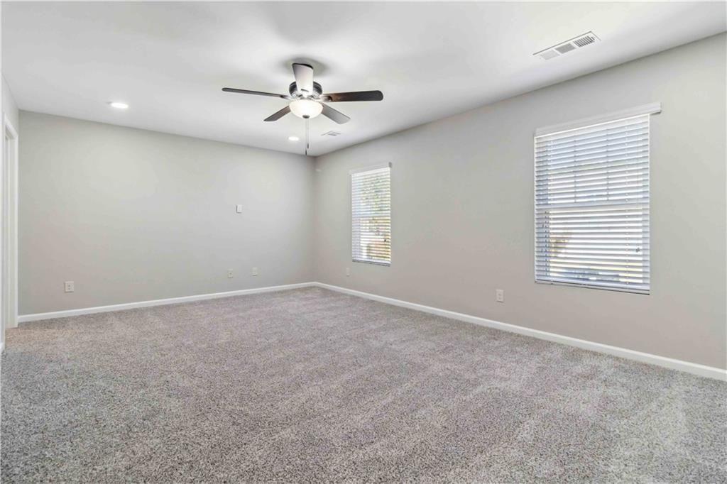 100 Heritage Club Circle Dallas, GA 30132 - Photo 13 of 26 an empty room with windows and fan