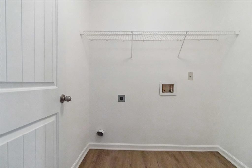 100 Heritage Club Circle Dallas, GA 30132 - Photo 15 of 26 a view of a room with racks on the wall