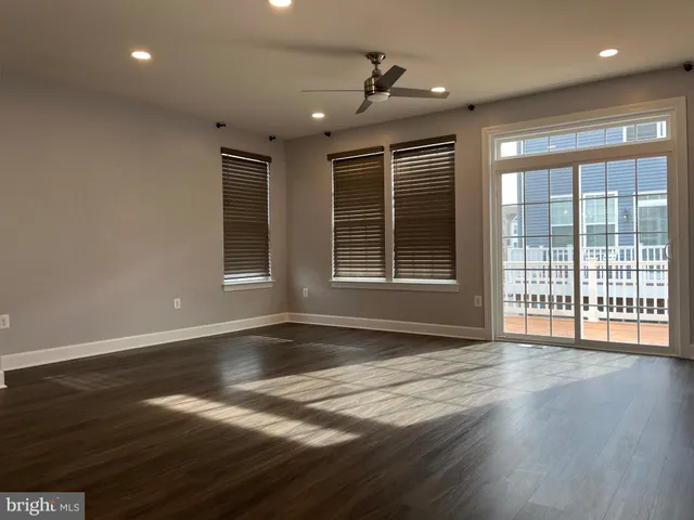 a kitchen with refrigerator and cabinets