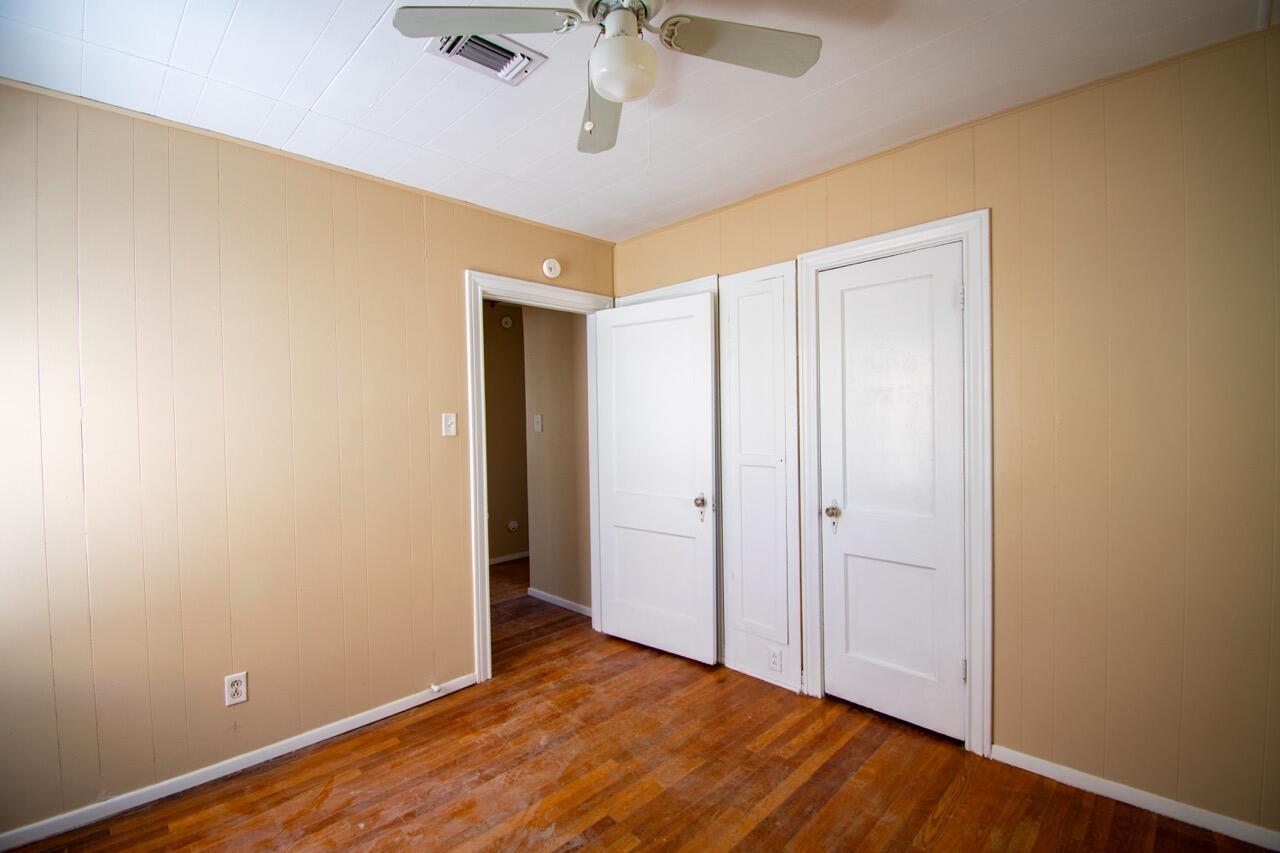 2424 27th Street Lubbock, TX 79411 - Photo 12 of 14 wooden floor in an empty room