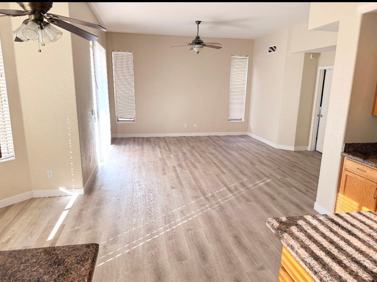 17640 North 17th Street Phoenix, AZ 85022 - Photo 5 of 21 a view of a room with wooden floor and staircase
