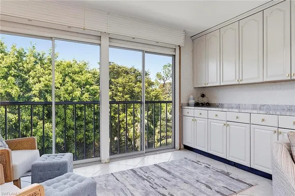 a view of a kitchen with furniture and staircase