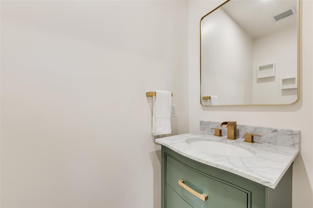 3106 Sharpview Lane Dallas, TX 75228 - Photo 14 of 33 a bathroom with a sink and a mirror