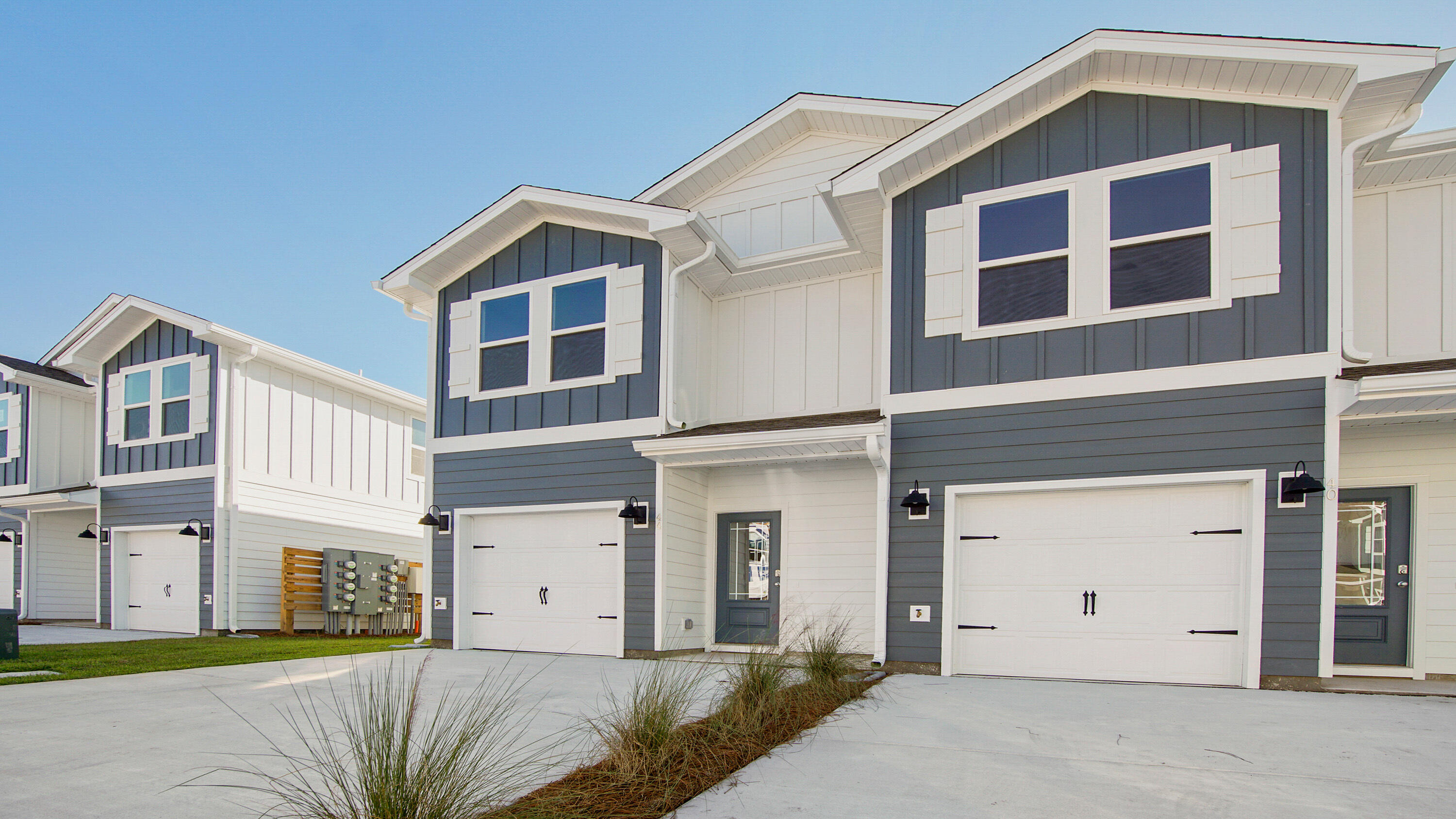 159 Sparrow Avenue Santa Rosa Beach, FL 32459 - Photo 2 of 35 a front view of a house with a yard