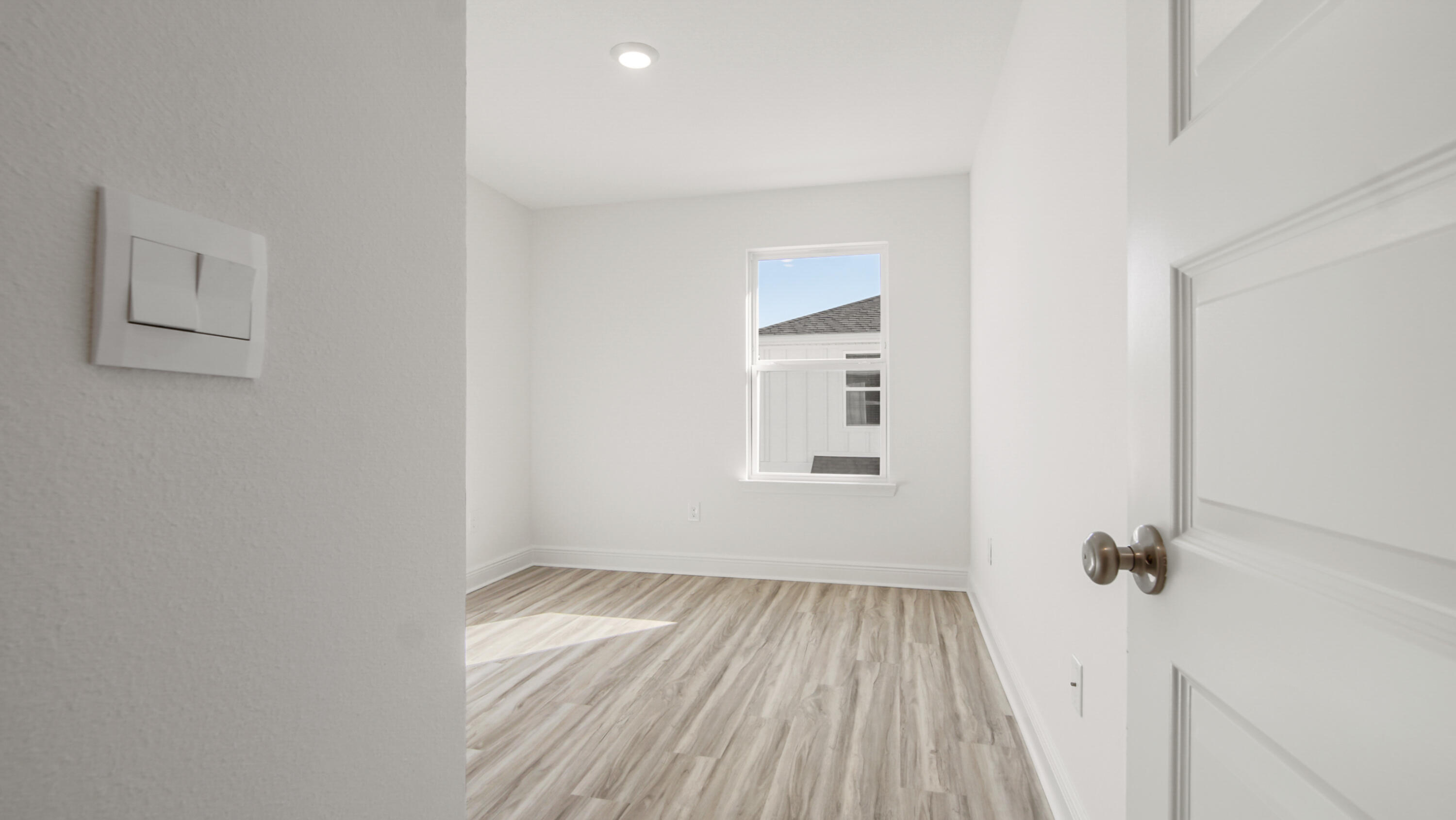 159 Sparrow Avenue Santa Rosa Beach, FL 32459 - Photo 23 of 35 a view of a room with wooden floor and a window