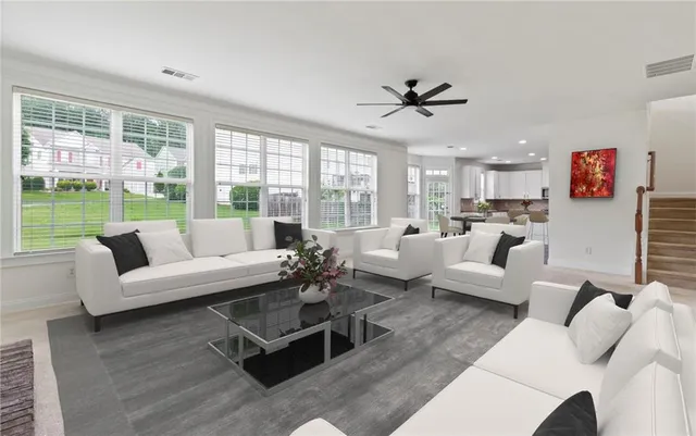 a living room with furniture and a large window