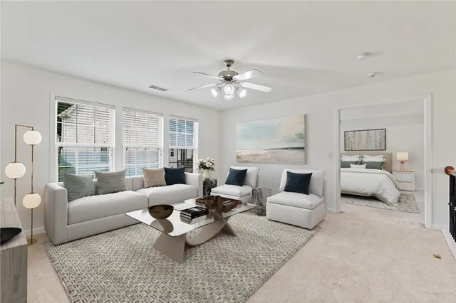 a living room with furniture and a large window