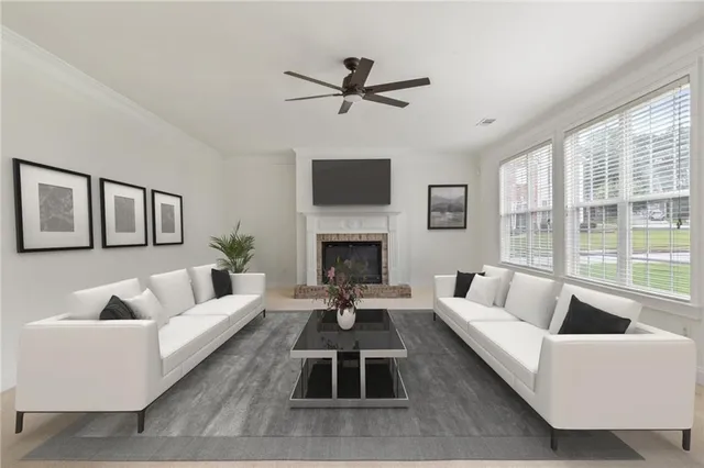 a living room with furniture and a fireplace