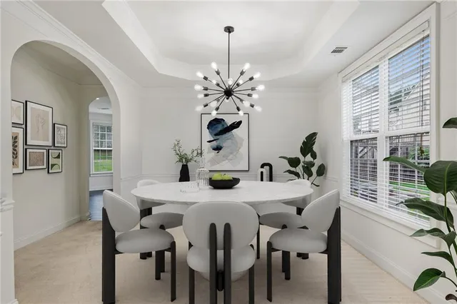 a view of a dining room with furniture and window