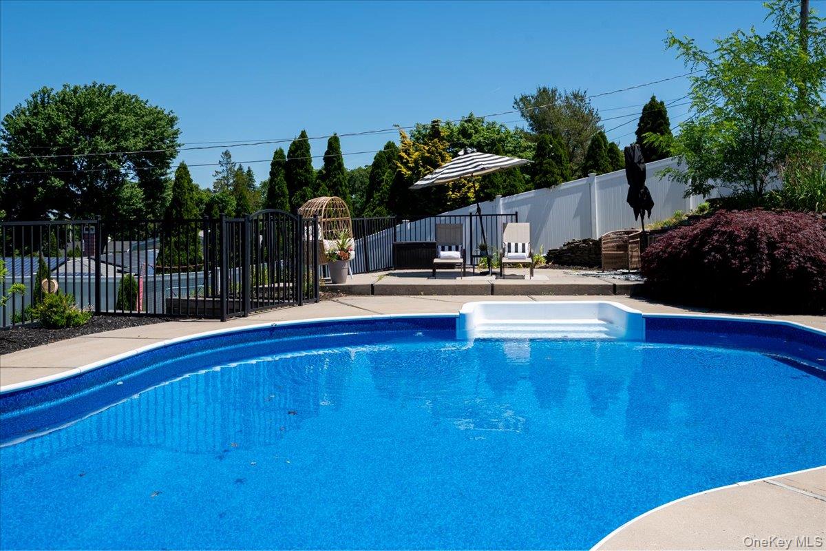 10 Rutgers Road Farmingville, NY 11738 - Photo 25 of 27 a view of a swimming pool with a patio