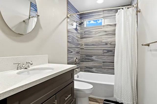 a bathroom with a sink a toilet and a bathtub