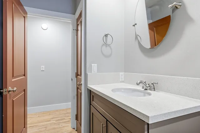 a bathroom with a sink and a mirror