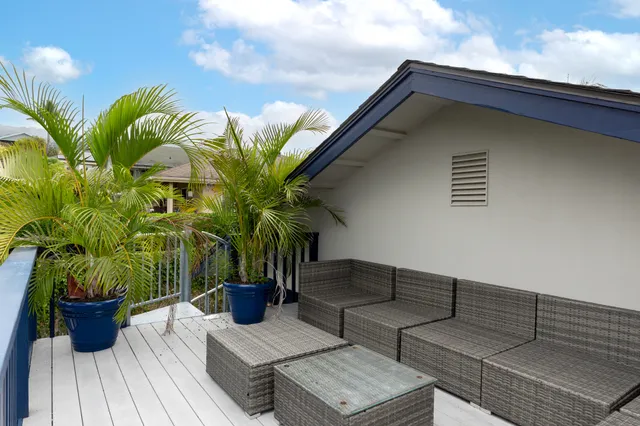 a view of a couches on the roof deck