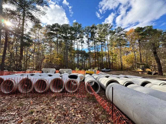 a front view of a house with swimming pool and outdoor seating