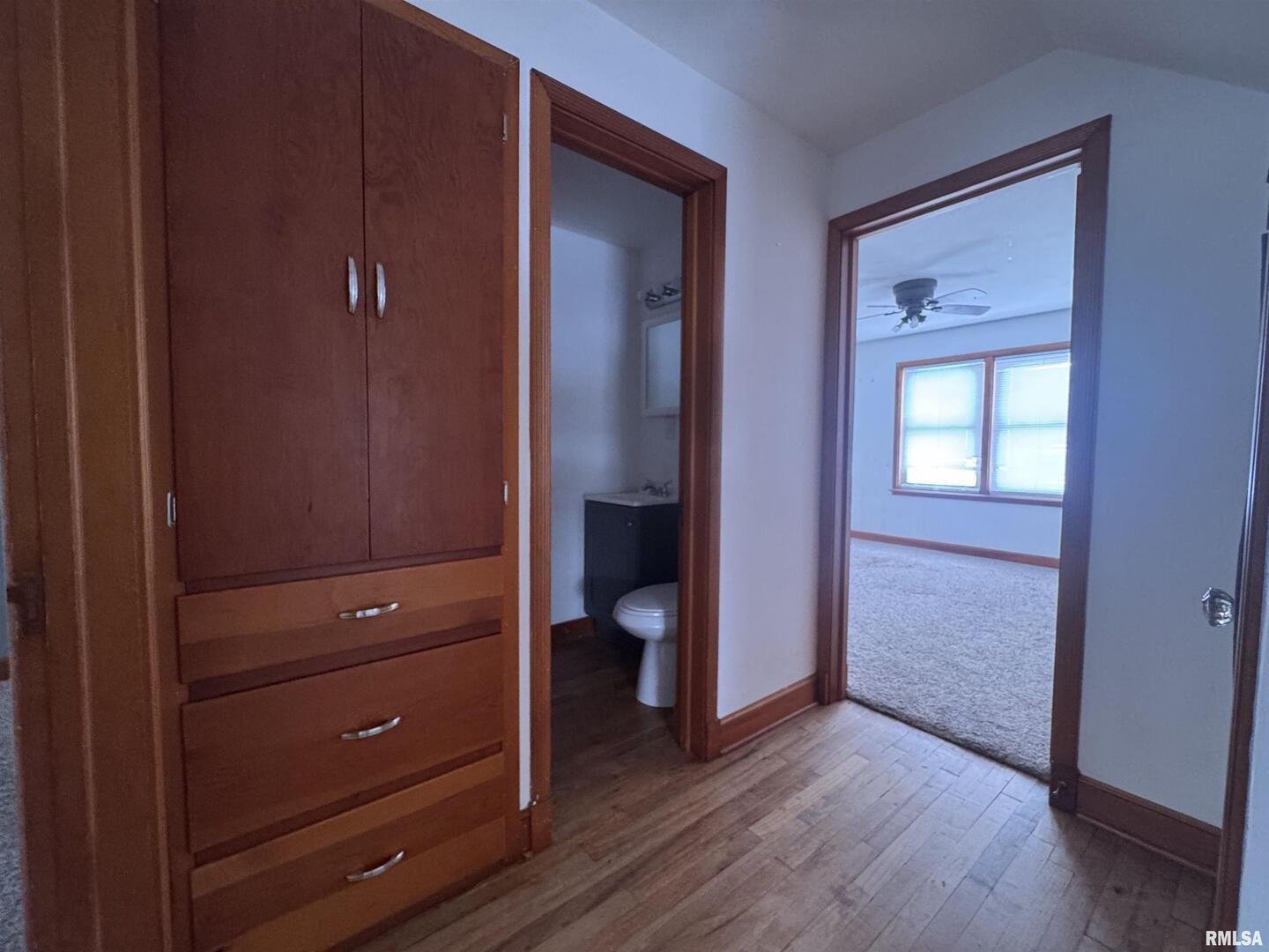 602 Washington Avenue Lowden, IA 52255 - Photo 21 of 28 wooden floor and closet area