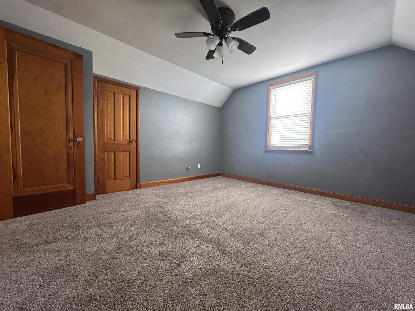 602 Washington Avenue Lowden, IA 52255 - Photo 22 of 28 an empty room with windows and fan