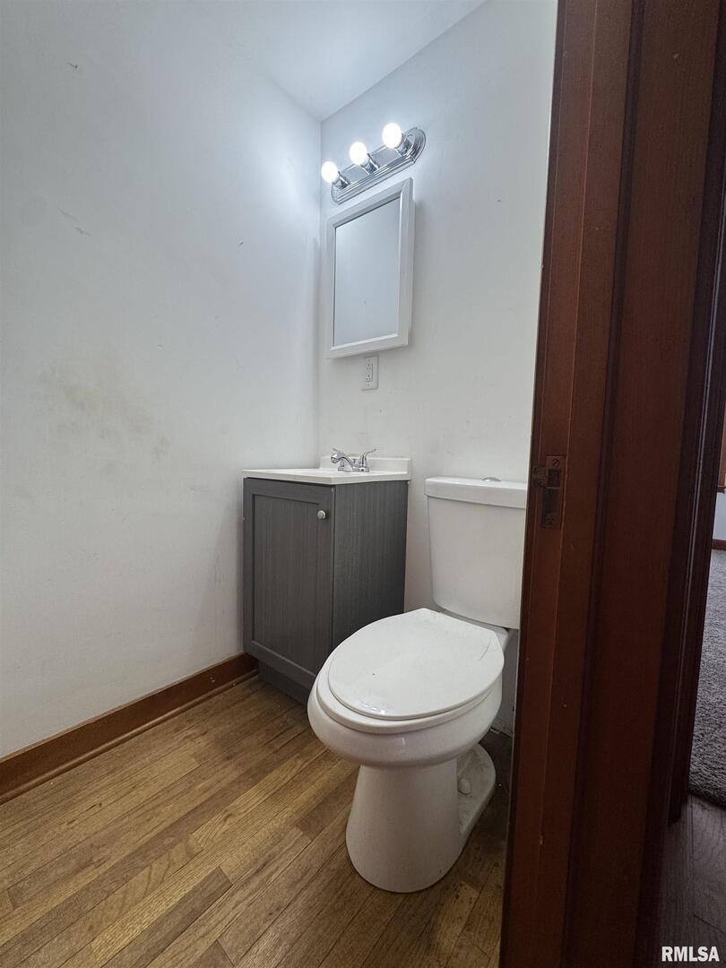 602 Washington Avenue Lowden, IA 52255 - Photo 26 of 28 a bathroom with a toilet and a sink