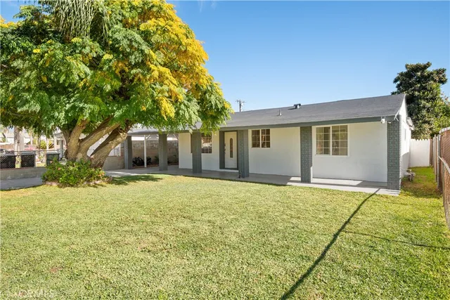 a house with trees in front of it