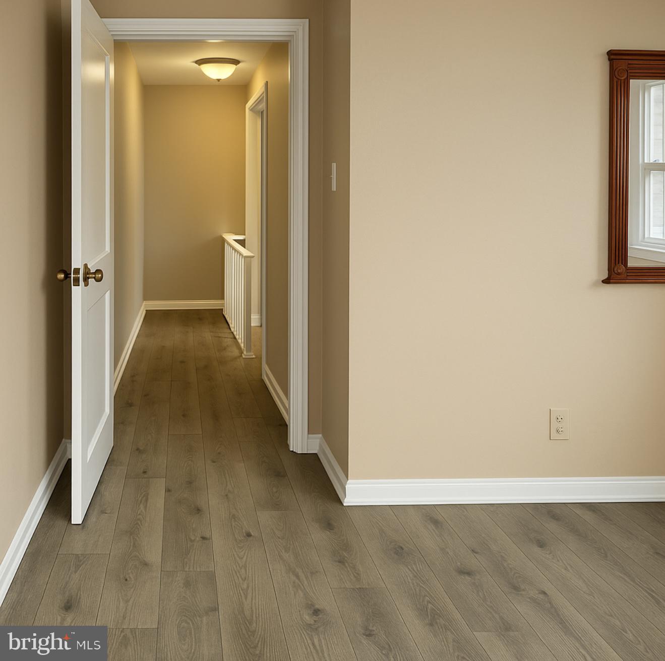 209 Glendale Road Upper Darby, PA 19082 - Photo 13 of 17 a view of a hallway with wooden floor and a bathroom