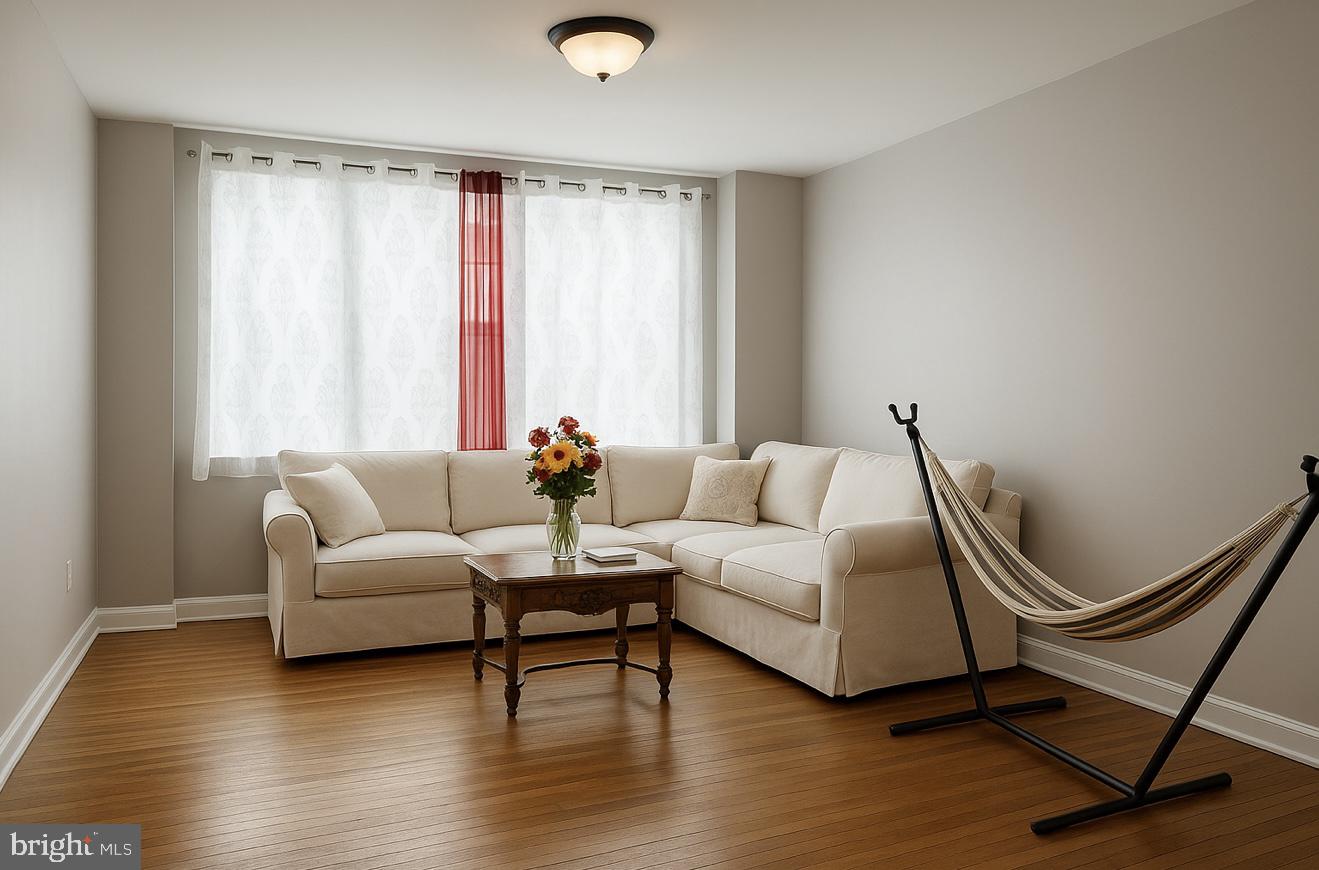 209 Glendale Road Upper Darby, PA 19082 - Photo 3 of 17 a living room with furniture and a window