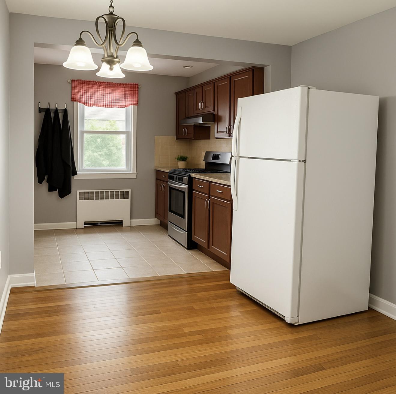 209 Glendale Road Upper Darby, PA 19082 - Photo 4 of 17 a kitchen with a refrigerator a stove top oven a counter space and wooden floor