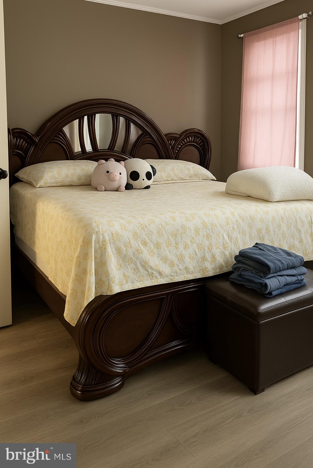 209 Glendale Road Upper Darby, PA 19082 - Photo 8 of 17 a bed sitting in a bedroom next to a window