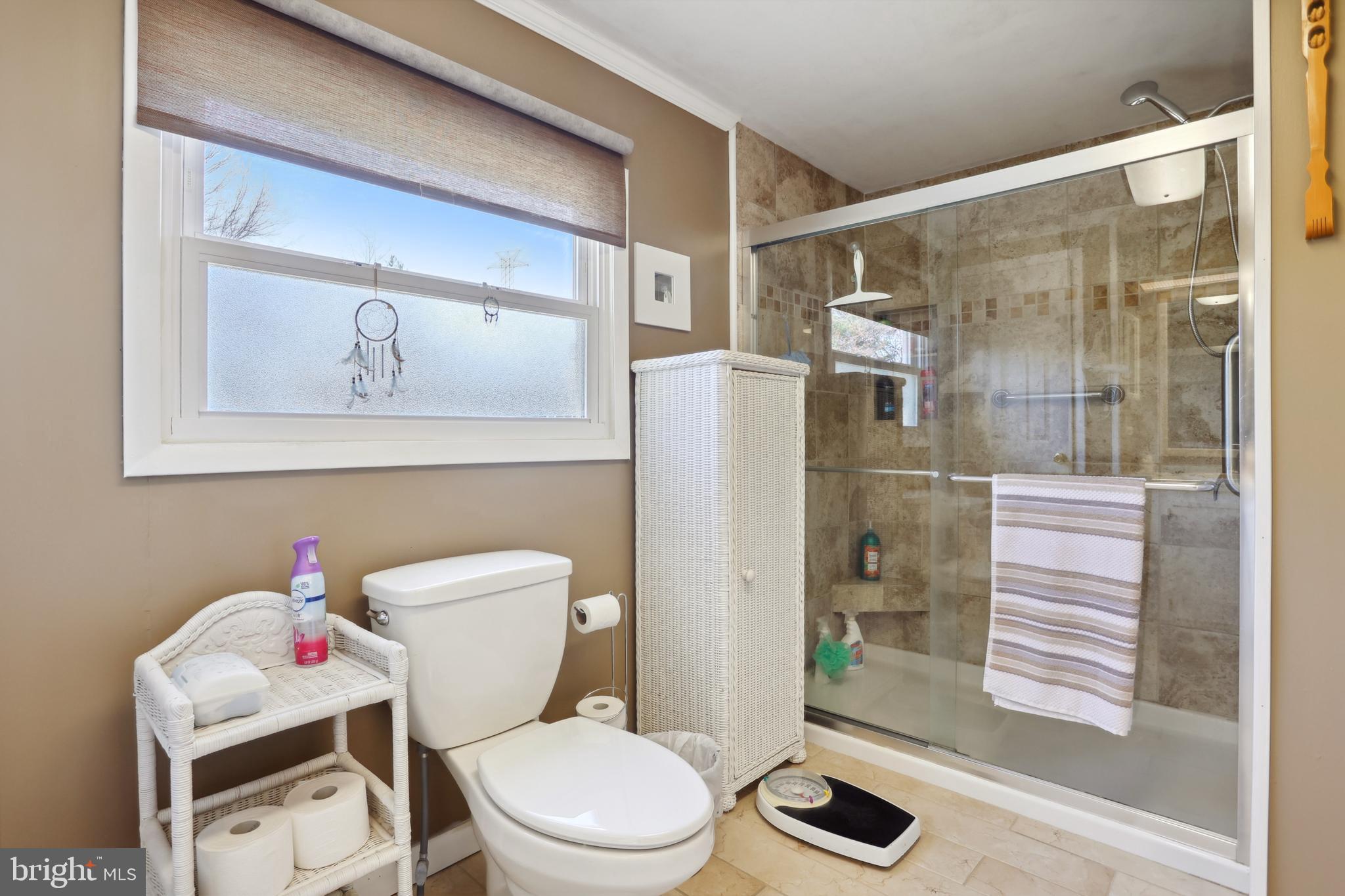 1122 Lemur Lane Mount Laurel, NJ 08054 - Photo 11 of 18 a white toilet sitting next to a bathroom sink