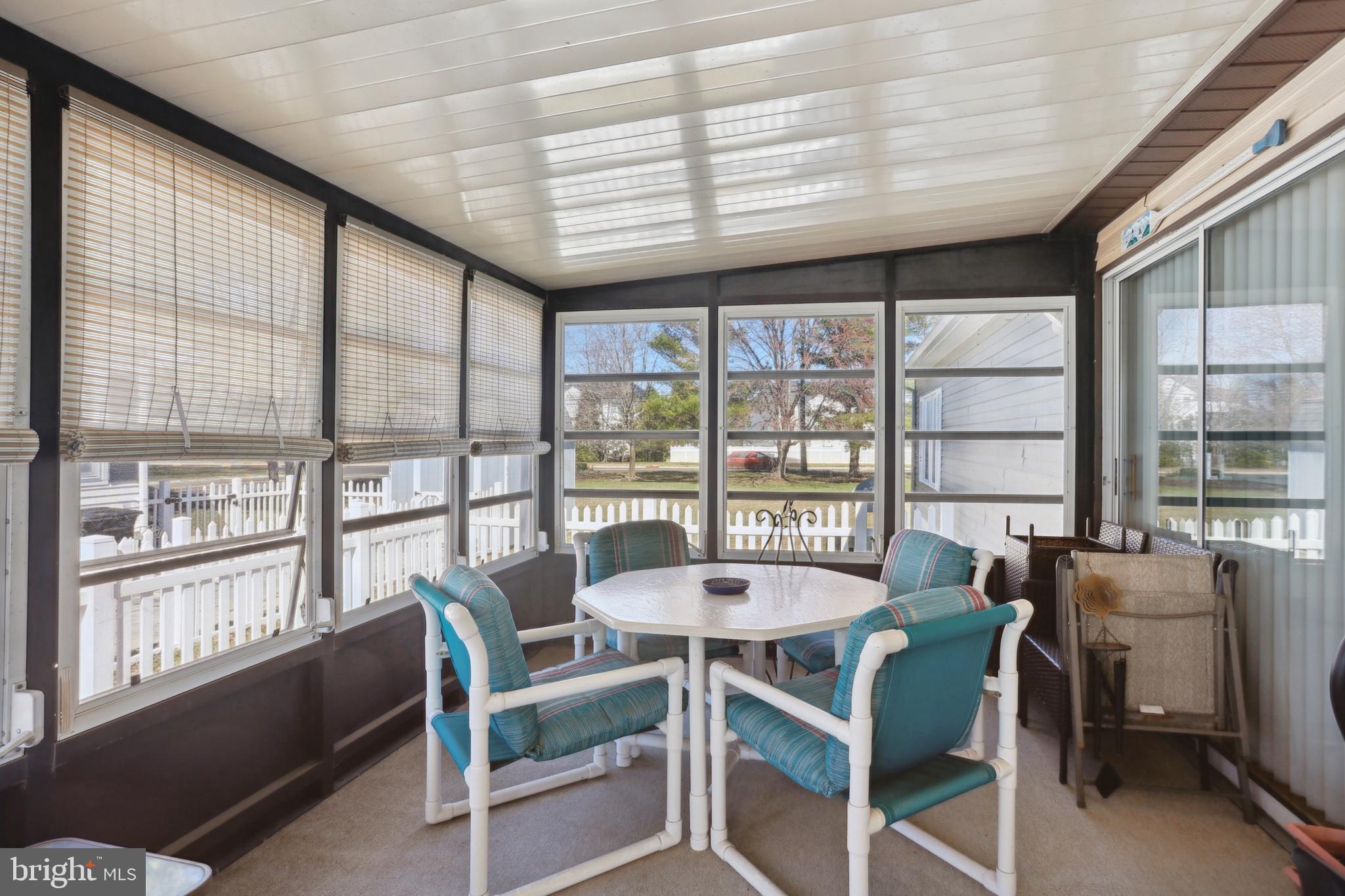 1122 Lemur Lane Mount Laurel, NJ 08054 - Photo 12 of 18 a view of a dining room with furniture large windows and wooden floor