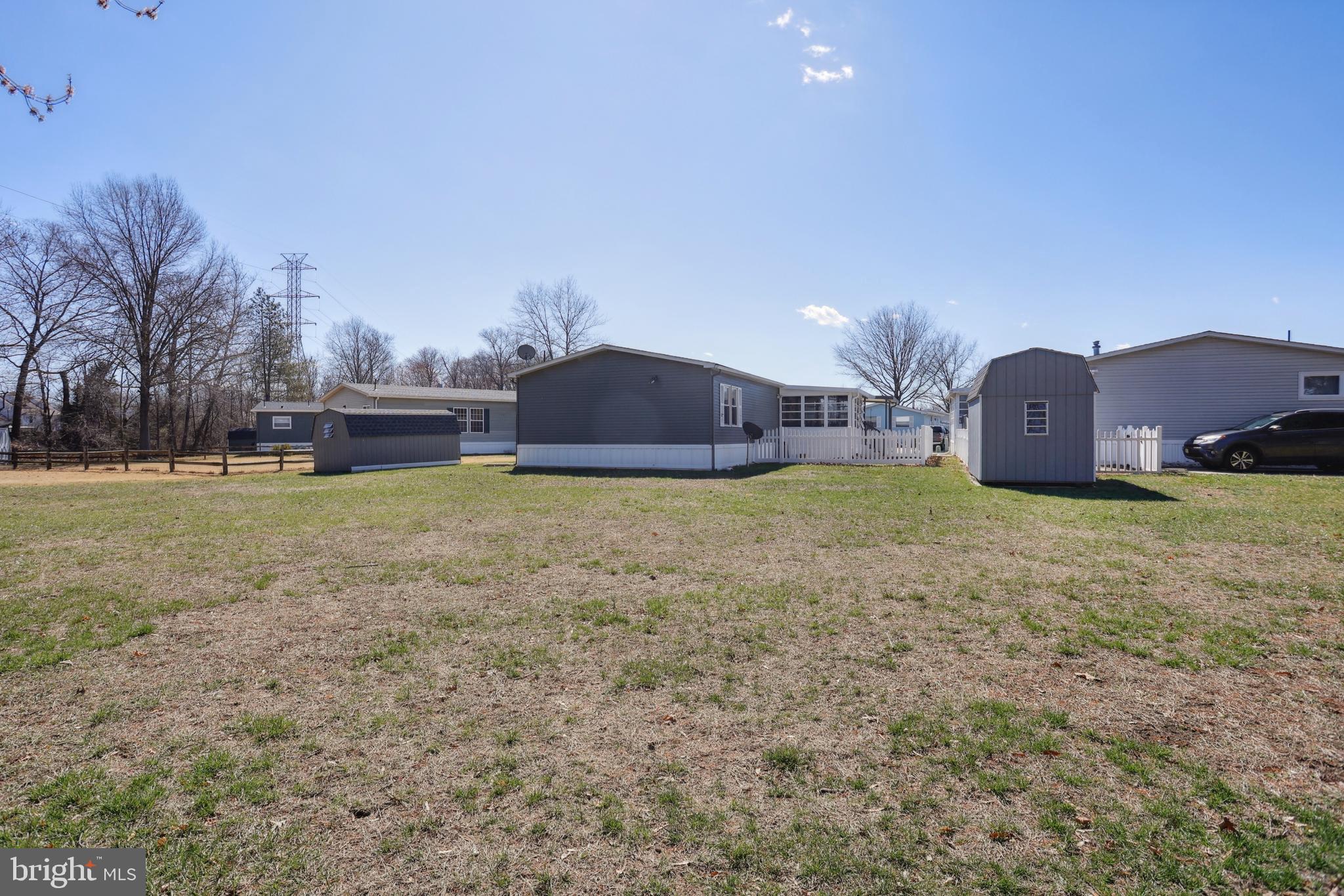 1122 Lemur Lane Mount Laurel, NJ 08054 - Photo 16 of 18 a view of a house with a yard and a large tree