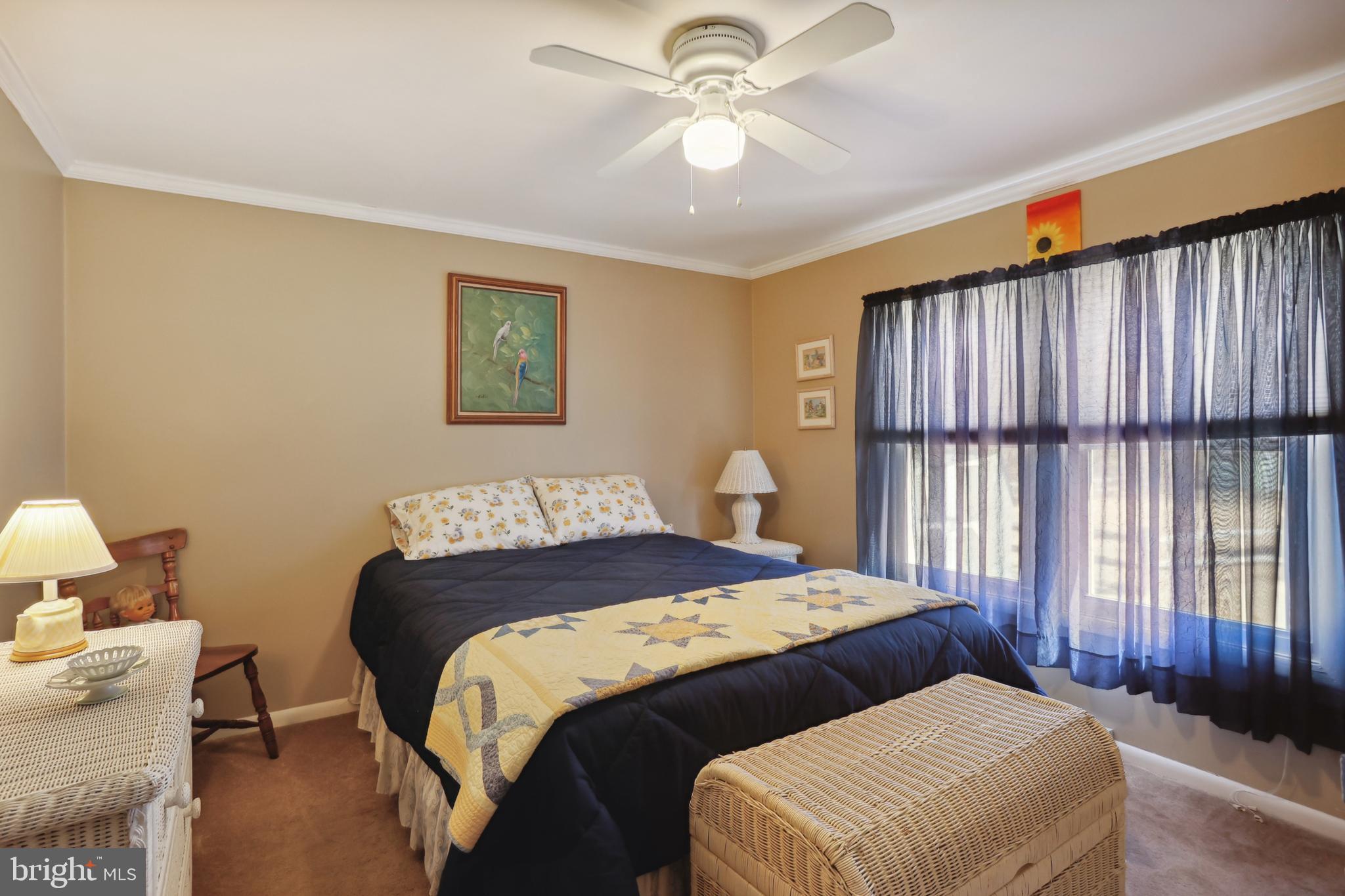 1122 Lemur Lane Mount Laurel, NJ 08054 - Photo 7 of 18 a bedroom with a bed and a chandelier