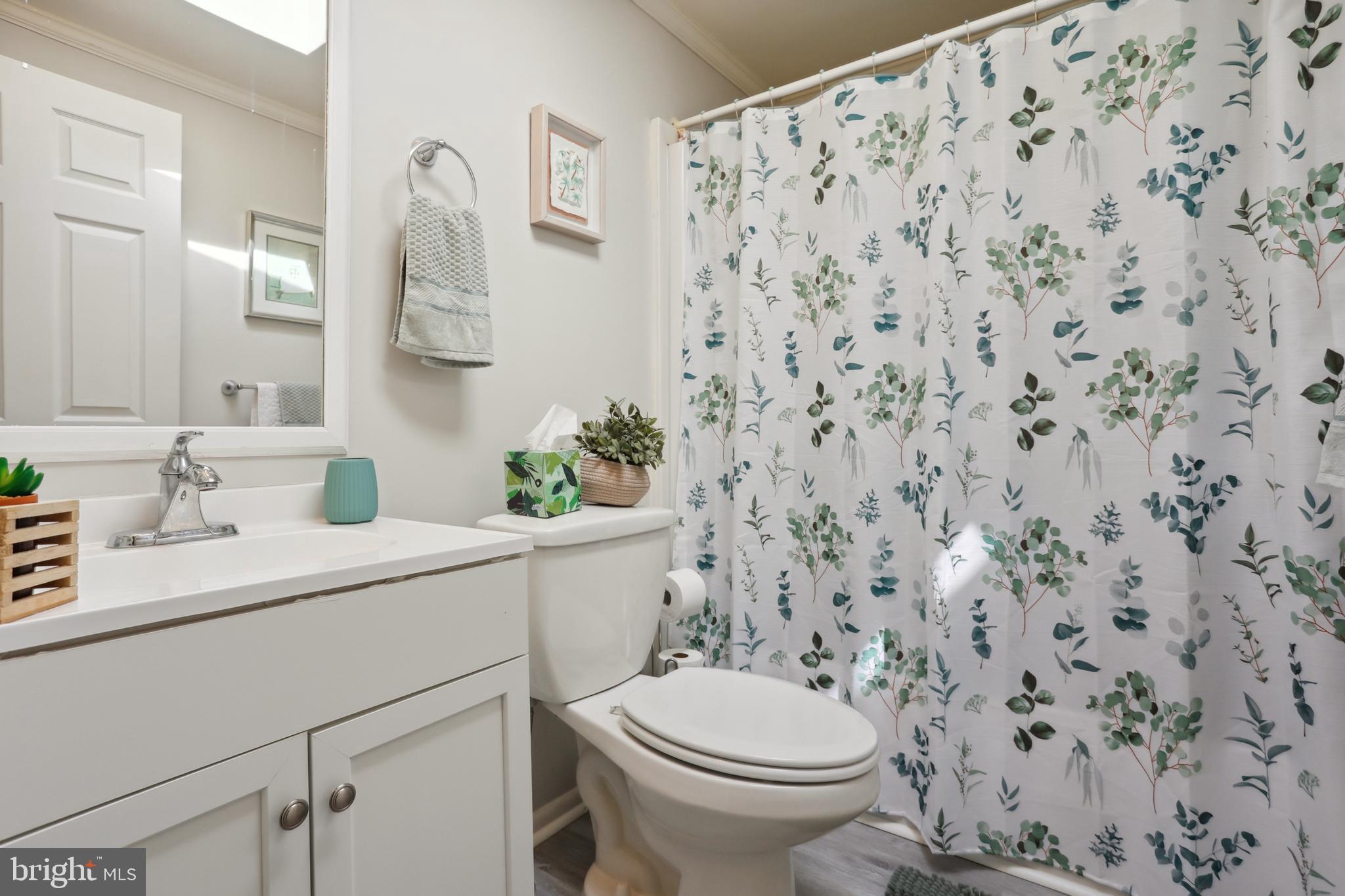 1122 Lemur Lane Mount Laurel, NJ 08054 - Photo 8 of 18 a bathroom with a sink toilet and mirror