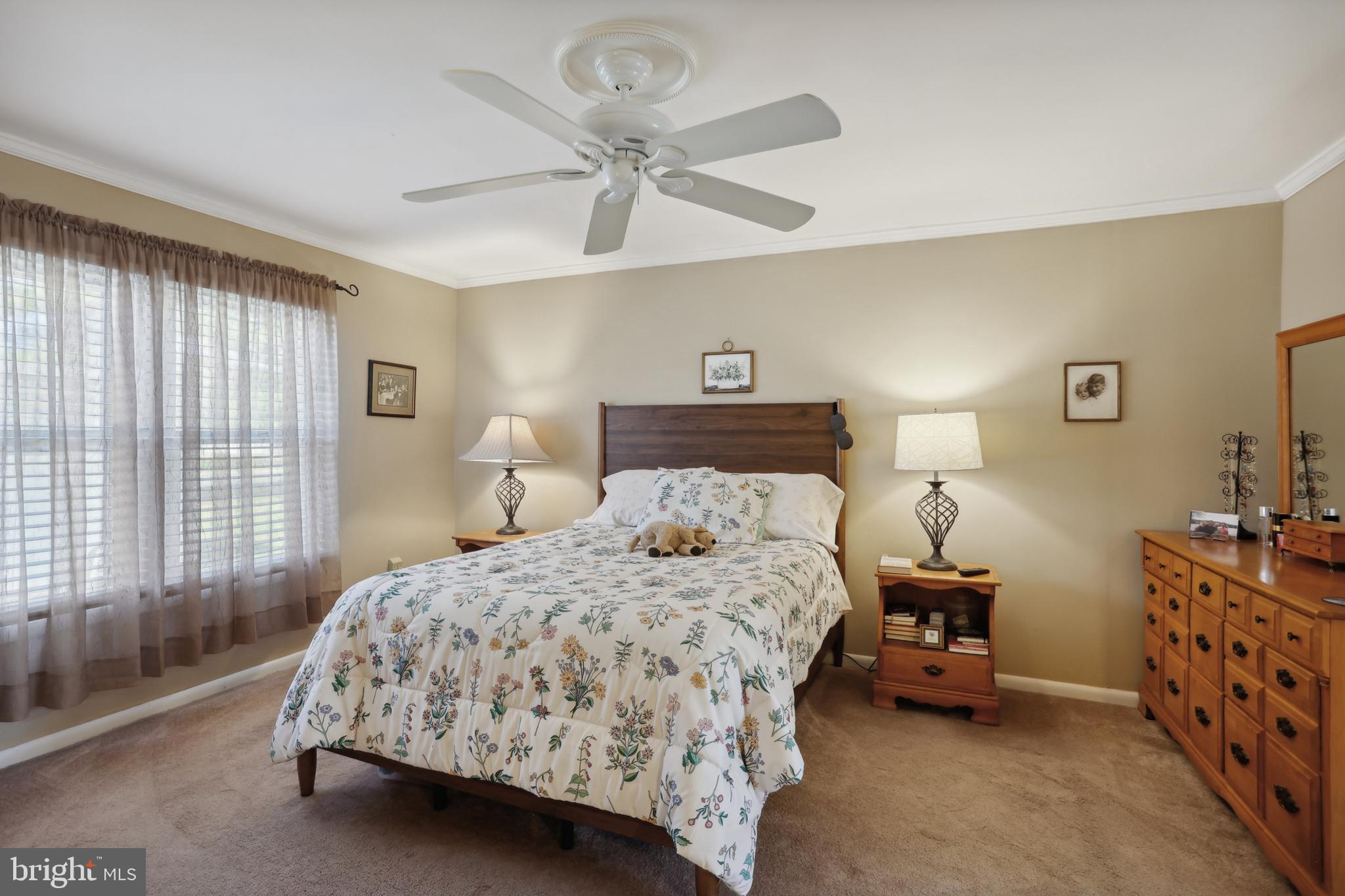 1122 Lemur Lane Mount Laurel, NJ 08054 - Photo 9 of 18 a bedroom with a bed and a chandelier