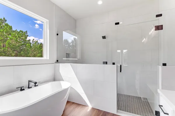 a bathroom with a bathtub and a sink