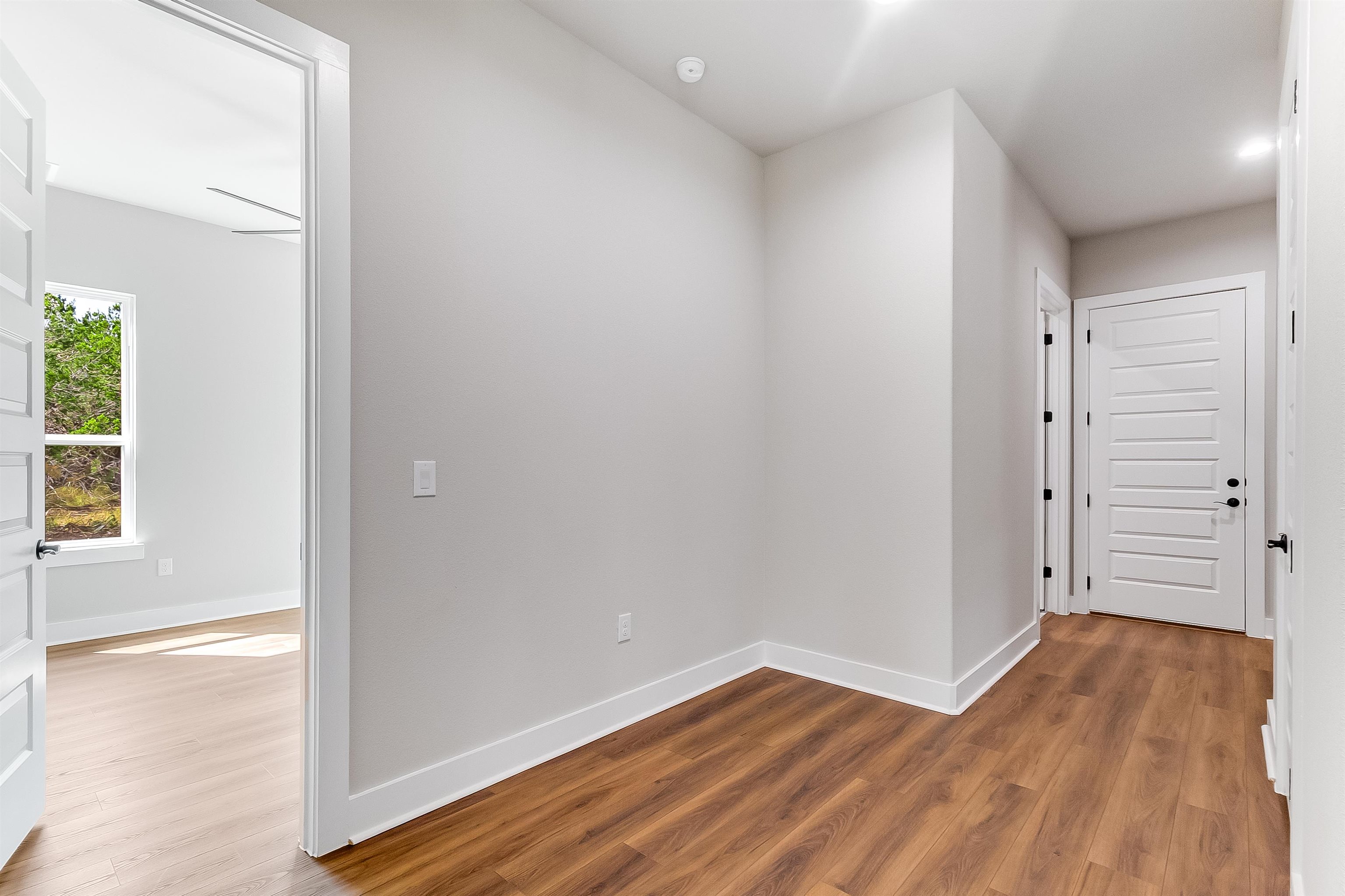 179 Rosebud Rnch Road Bertram, TX 78605 - Photo 18 of 28 wooden floor in an empty room