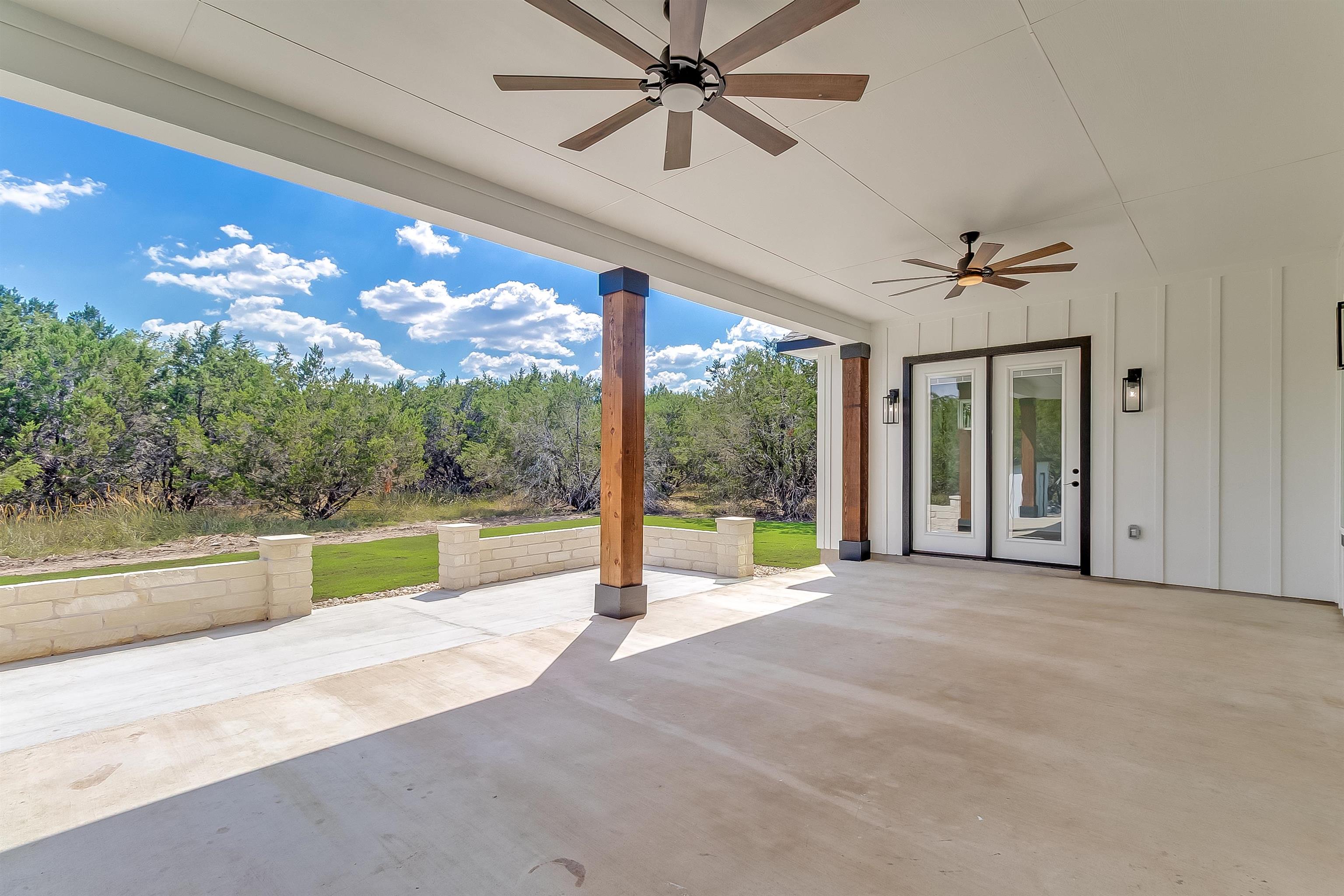 179 Rosebud Rnch Road Bertram, TX 78605 - Photo 26 of 28 a view of a swimming pool with a table and chairs