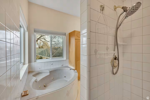 11789 Nicklaus Road Sandy, UT 84092 - Photo 42 of 58 Full bathroom featuring a shower stall and a jetted tub