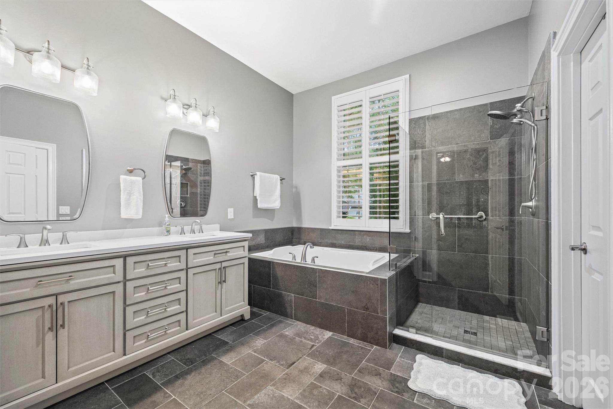 2578 Lower Assembly Drive Fort Mill, SC 29708 - Photo 15 of 28 a spacious bathroom with sink shower and mirror