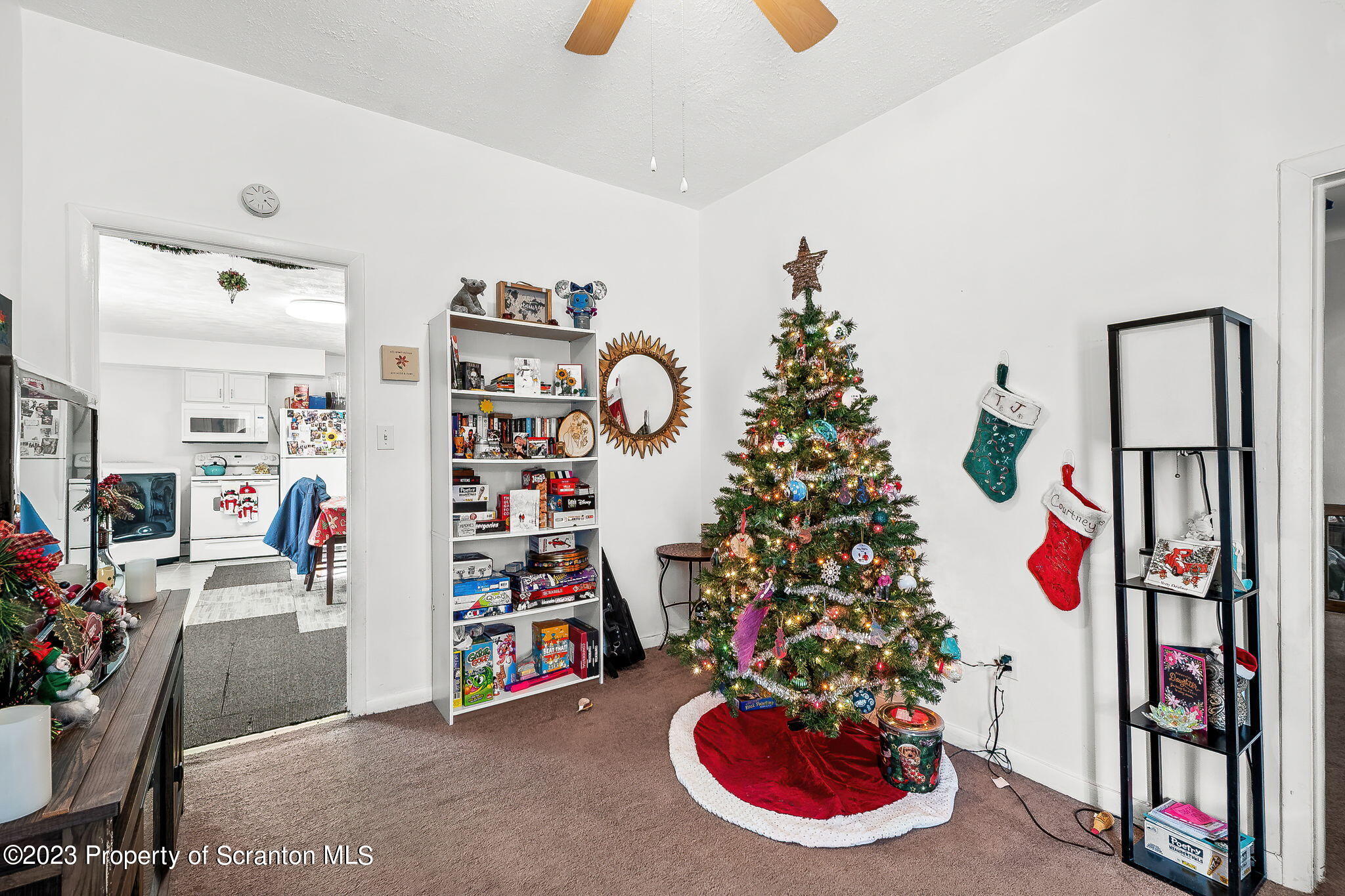 1023 Mark Avenue Scranton, PA 18510 - Photo 16 of 23 a living room with lots of furniture and a book shelf